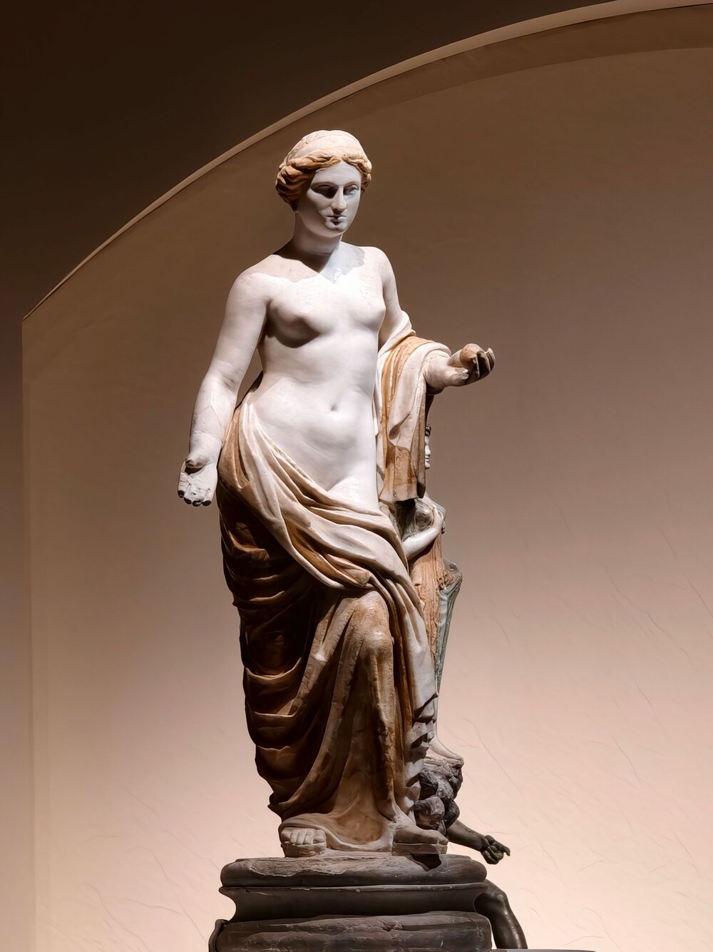 Classical marble statue in a museum niche